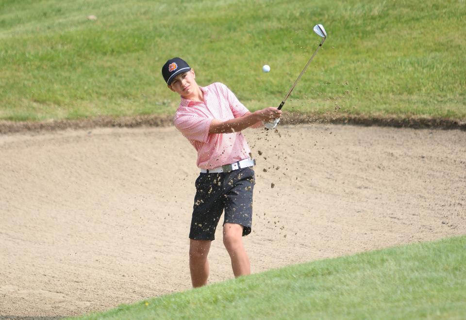 Brighton's Riley Morton hits out of the sand during the state Division 1 golf tournament Saturday, June 10, 2023 at The Meadows in Allendale.
