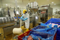 Dumidru Voicu nets meat at Cranswick Convenience Foods in Milton Keynes, Britain November 20, 2017. Picture taken November 20, 2017. REUTERS/Darren Staples