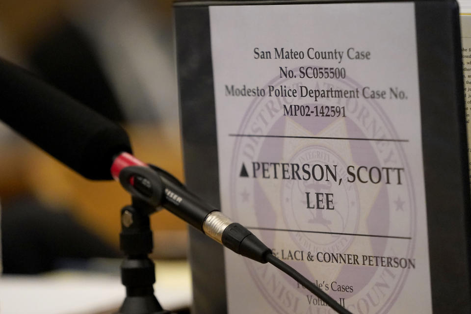 A binder is shown at the San Mateo County Superior Court in Redwood City, Calif., Thursday, Aug. 11, 2022. Scott Peterson is in court for a hearing to determine whether he gets a new trial in the murder of his pregnant wife because of juror misconduct. (AP Photo/Jeff Chiu, Pool)