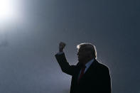 President Donald Trump pumps his fist as he departs after speaking at a campaign rally at Altoona-Blair County Airport, Monday, Oct. 26, 2020, in Martinsburg, Pa. (AP Photo/Alex Brandon)