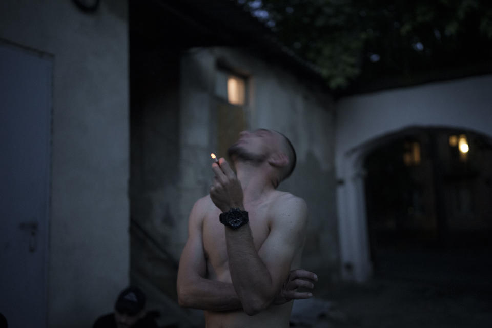 A Ukraine Special Operations Forces soldier smokes as he waits to leave for a night mission in Kherson region, Ukraine, Thursday, June 15, 2023. (AP Photo/Felipe Dana)
