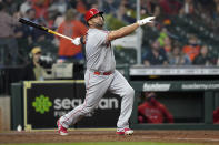 FILE - Los Angeles Angels' Albert Pujols hits a two-run home run against the Houston Astros during the sixth inning of a baseball game in Houston, in this Thursday, April 22, 2021, file photo. Pujols has been designated for assignment by the Los Angeles Angels, abruptly ending the 41-year-old superstar slugger's decade with his second major league team. The Angels announced the move Thursday, May 6, 2021, a day after Pujols wasn't in their lineup for their fourth consecutive loss. (AP Photo/David J. Phillip, File)