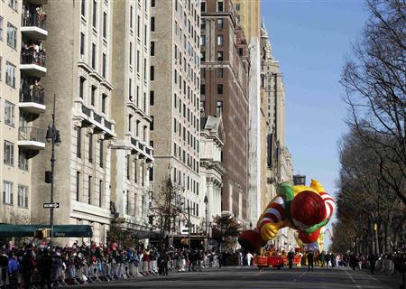 The Ronald McDonald balloon floats down Central Park West during the 87th Macy's Thanksgiving Day Parade in New York November 28, 2013. REUTERS/Gary Hershorn