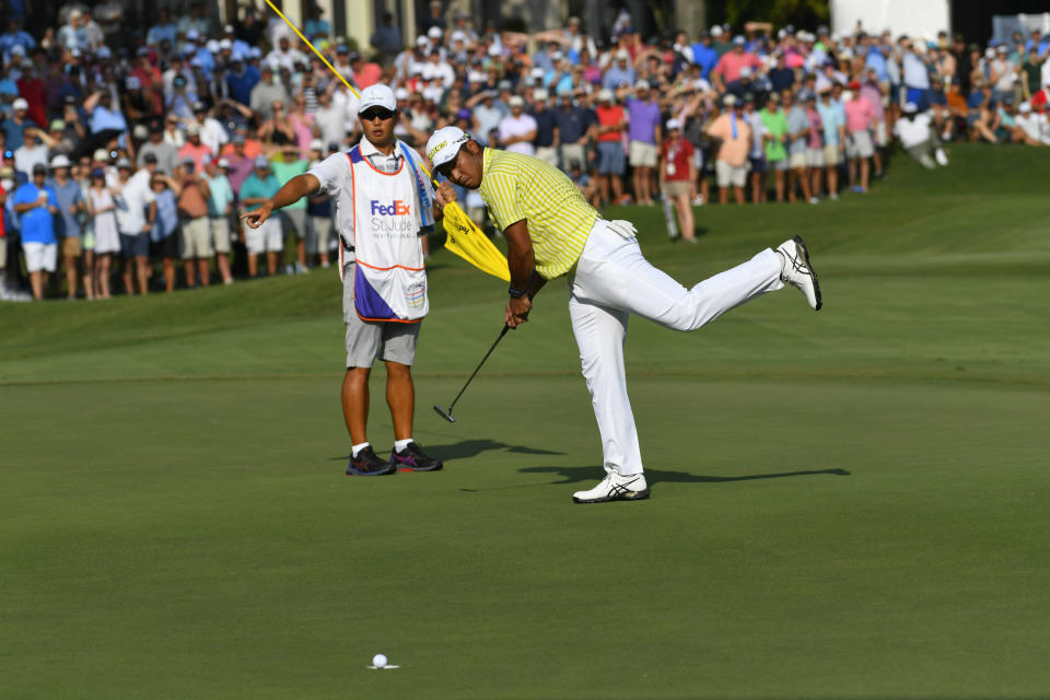 Hideki Matsuyama, of Japan, reacts after his putt for birdie falls short on the 18th green during the first playoff hole in the World Golf Championship-FedEx St. Jude Invitational tournament, Sunday, Aug. 8, 2021, in Memphis, Tenn. (AP Photo/John Amis)