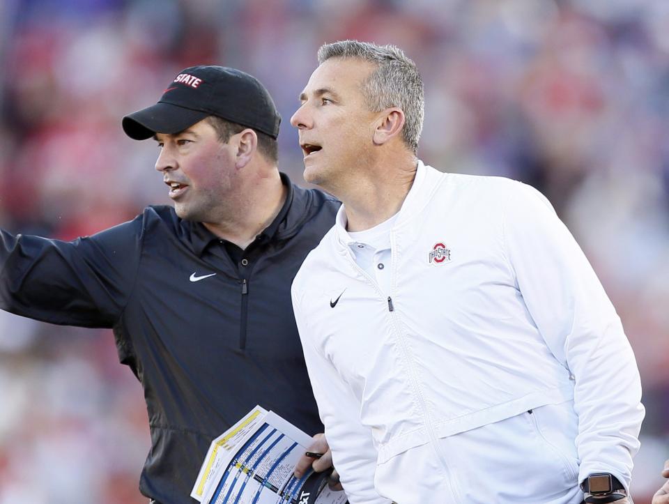 Ohio State coach Urban Meyer and offensive coordinator Ryan Day yell from the sideline during 2019 Rose Bowl.