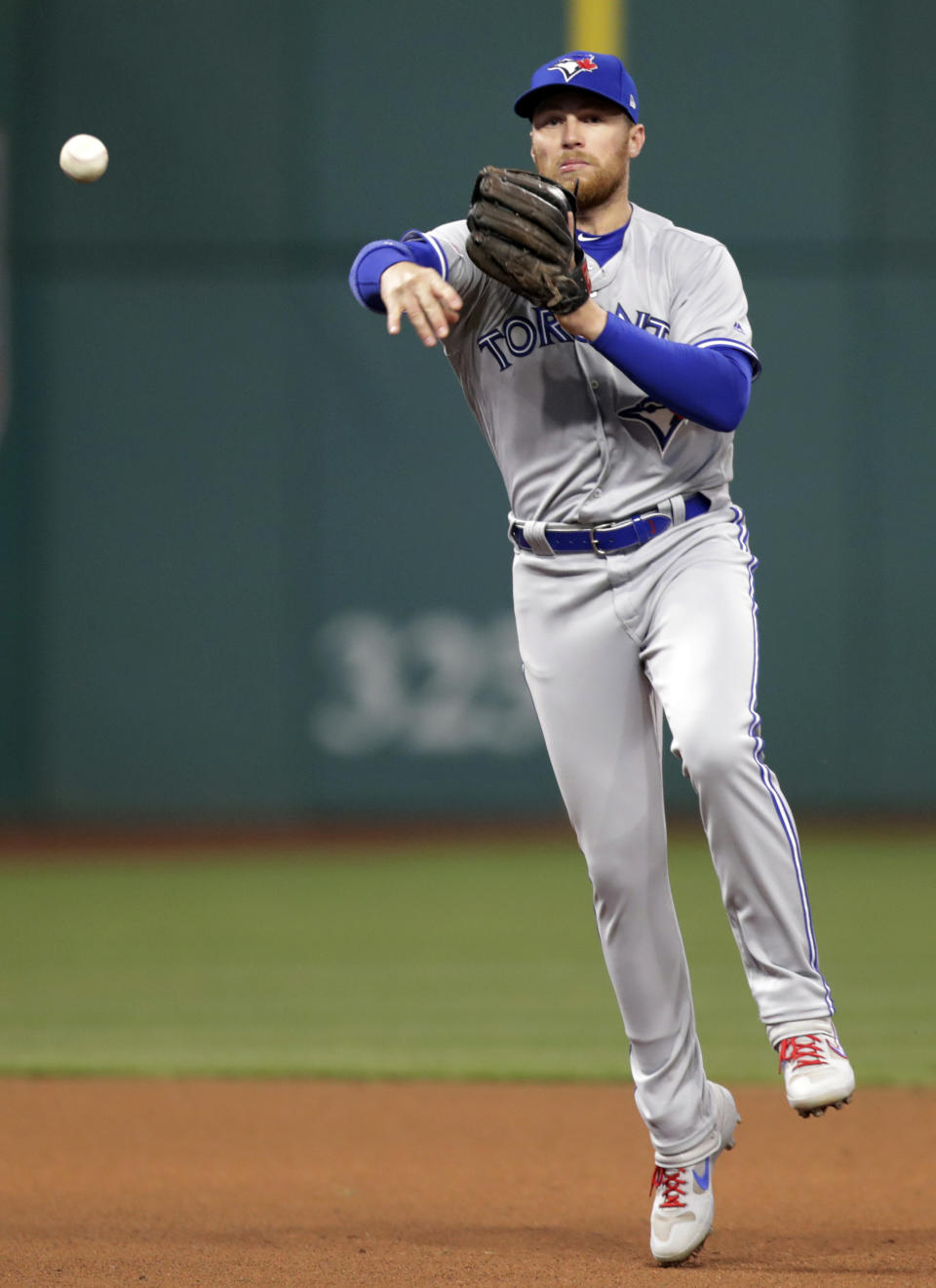 Toronto Blue Jays' Freddy Galvis throws out Cleveland Indians' Carlos Santana at first base during the fourth inning of a baseball game Friday, April 5, 2019, in Cleveland. (AP Photo/Tony Dejak)