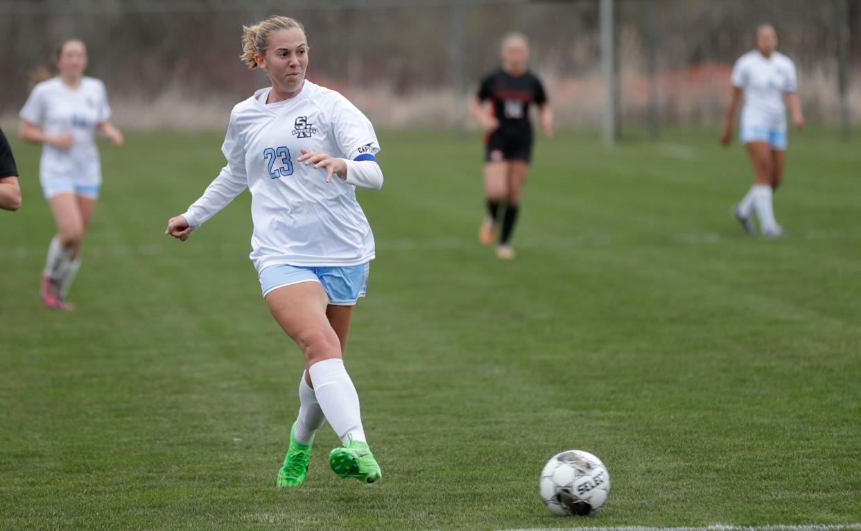 Sheboygan North’s Erica Herzog (23) drives the ball against Plymouth, Thursday, April 11, 2024, in Plymouth, Wis.