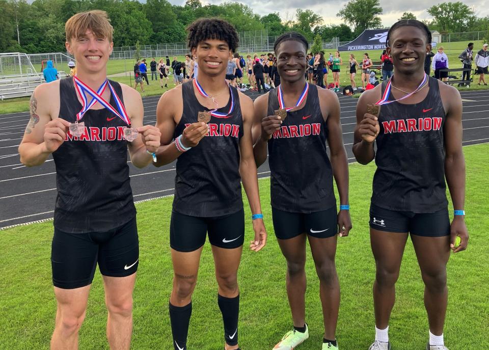 Brennin Beechum, left, stands with Kaedan Faggs, Te'Sean Jefferson and Trinity Keith after qualifying for the Division I state meet during the Pickerington North regional by placing fourth in 42.11.