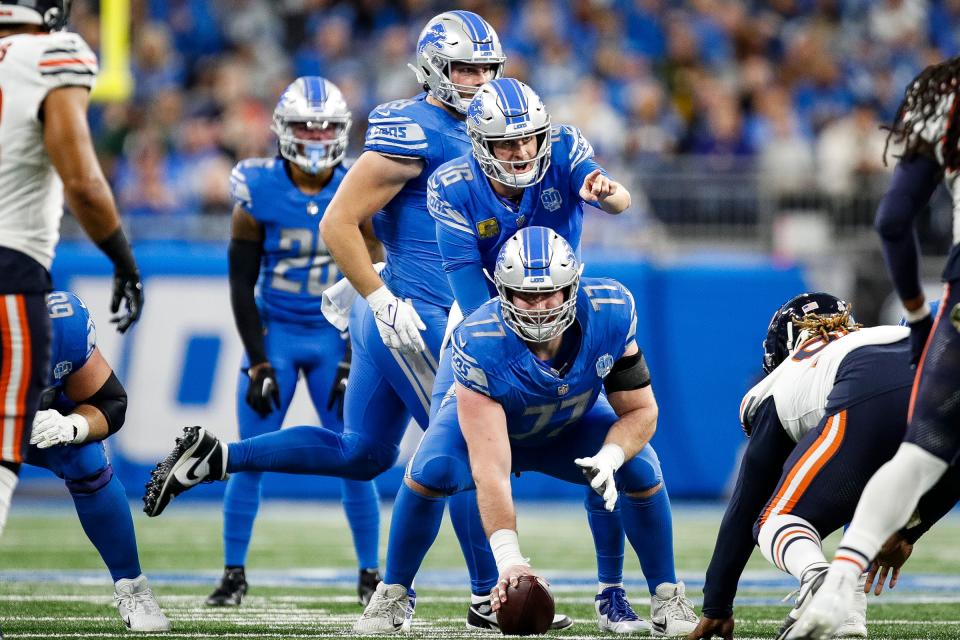 Detroit Lions quarterback Jared Goff talks to center Frank Ragnow before a play against the Chicago Bears during the first half at Ford Field in Detroit on Sunday, Nov. 19, 2023.