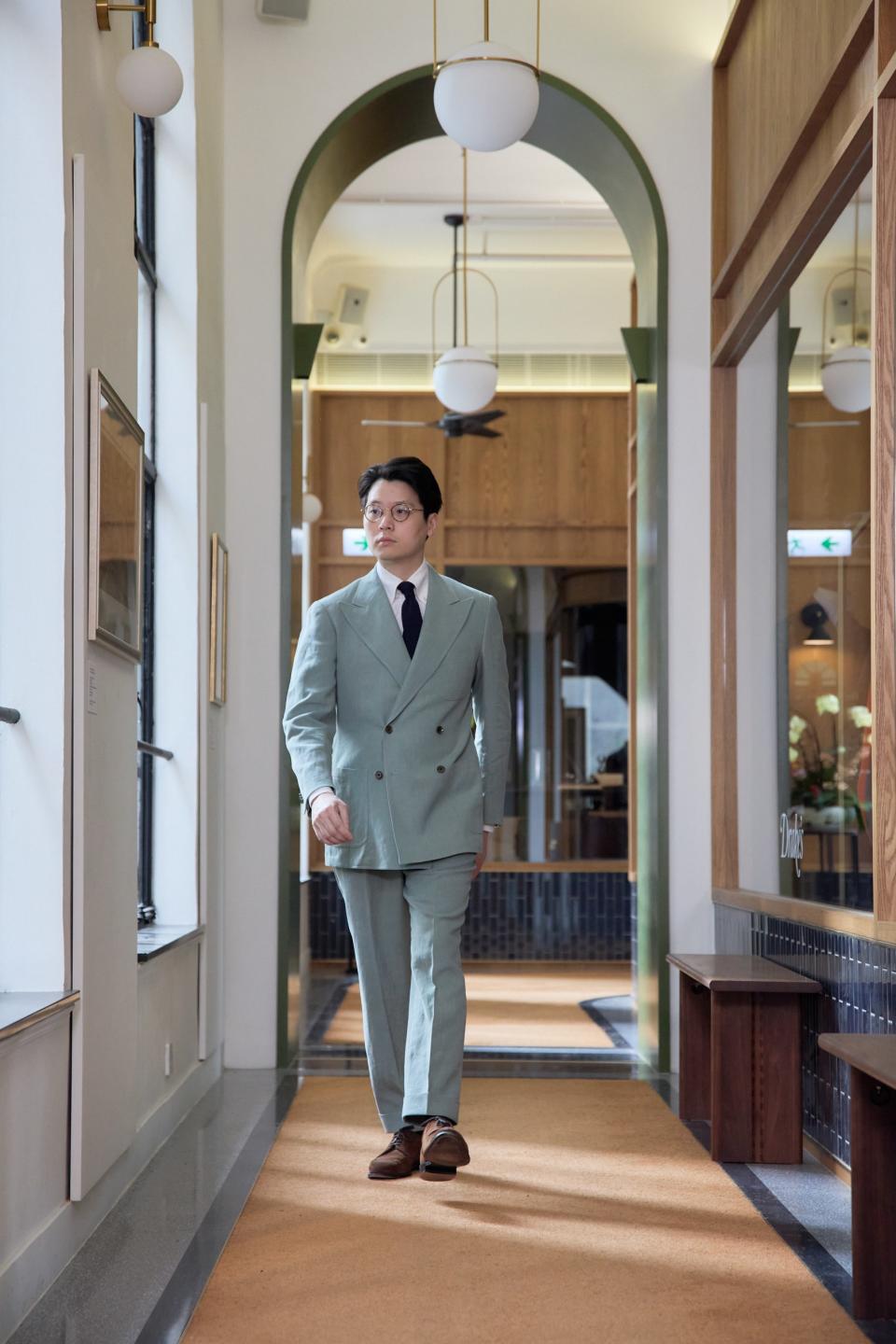 The Armoury co-founder Mark Cho showing off the mobility of his sharply-cut suit.