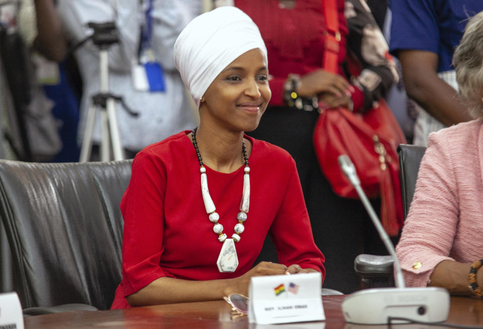 Rep. Ilhan Omar, one of the delegation lead by US House Speaker Nancy Pelosi, looks on Ghana's Parliament in Accra, Ghana, Wednesday, July 31, 2019. U.S. House Speaker Nancy Pelosi is in Ghana as the head of a Congressional delegation to address Ghana's lawmakers on Wednesday. While in Ghana, Pelosi and other members of the U.S. Congress plan discussions on "regional security, sustainable and inclusive development and the challenges of tomorrow including the climate crisis." (AP Photo/Christian Thompson) hake with Ghanas Menbers of Paliament as she exit the chamber. Ghana,Accra. 31 jul;y 2019 AP IMAGES/CHRISTIAN THOMPSON