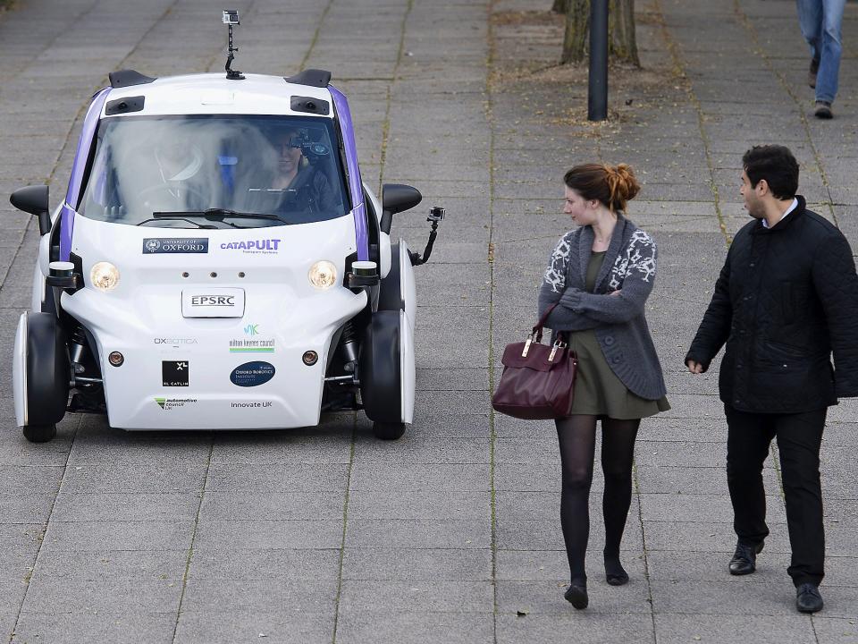 An autonomous self-driving vehicle being tested in a pedestrianised zone in Milton Keynes: Getty