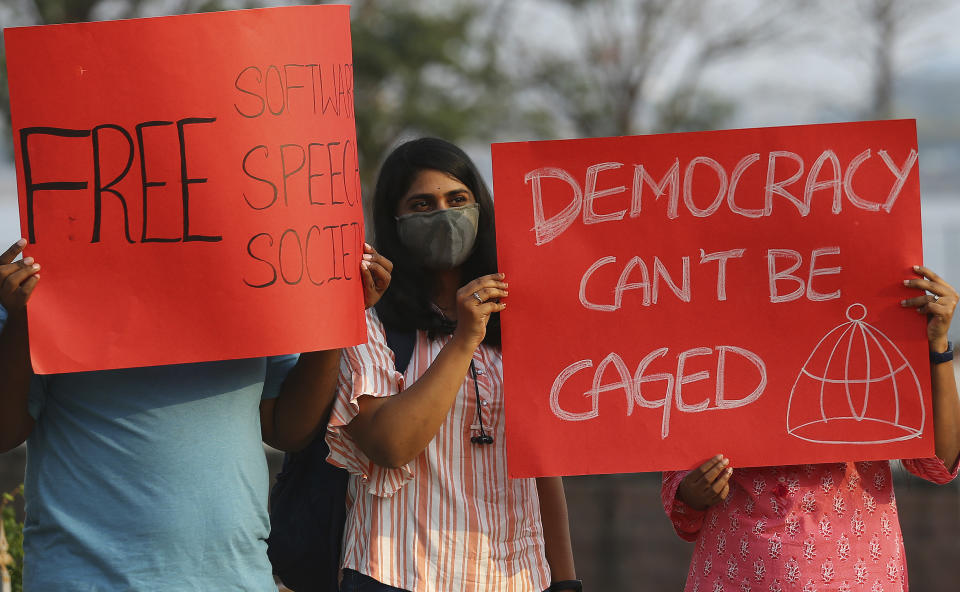 Activists participate in a silent protest against the arrest of environmental activist Disha Ravi in Hyderabad, India, Saturday, Feb. 20, 2021. The 22-year-old Indian climate activist who is facing sedition charges for her alleged role in the creation of an online document intended to help amplify farmer protests did not get bail Saturday after a court said it will reserve its order for next week. (AP Photo/Mahesh Kumar A.)