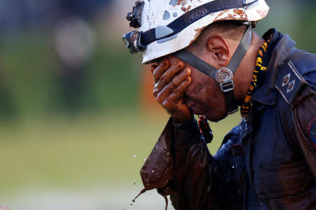A member of rescue team reacts, upon returning from the mission, after a tailings dam owned by Brazilian mining company Vale SA collapsed, in Brumadinho, Brazil January 27, 2019. REUTERS/Adriano Machado