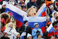 Fans hold Russian flags as they watch the women's slopestyle skiing competition at the 2014 Sochi Winter Olympic Games in Rosa Khutor February 11, 2014. REUTERS/Mike Blake (RUSSIA - Tags: SPORT SKIING OLYMPICS TPX IMAGES OF THE DAY)