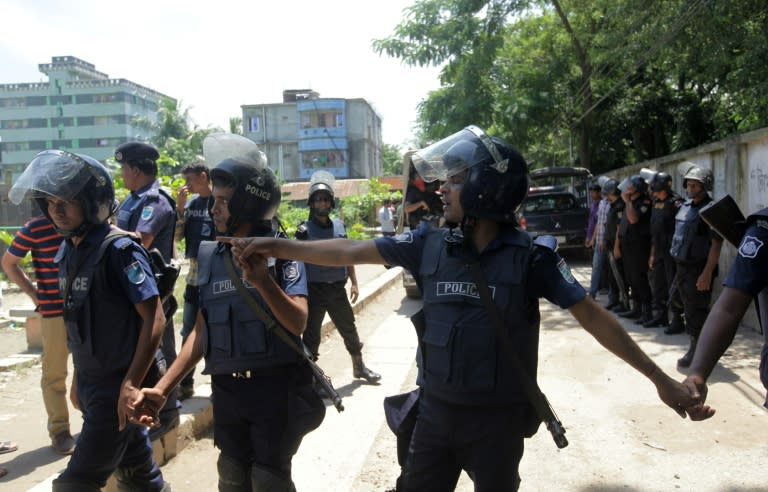 Bangladesh police stand guard around a militant hideout in Narayanganj after it was raided by police on August 27, 2016