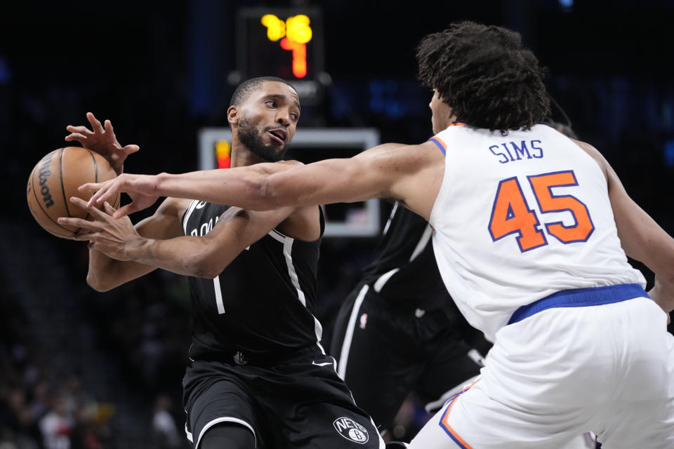 New York Knicks center Jericho Sims (45) guards Brooklyn Nets forward Mikal Bridges (1) during the second half of an NBA basketball game Tuesday, Jan. 23, 2024, in New York. (AP Photo/Mary Altaffer)