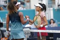 Mar 23, 2019; Miami Gardens, FL, USA; Su-Wei Hshieh of Chinese Taipei (R) shakes hands with Naomi Osaka of Japan (L) after their match in the second round of the Miami Open at Miami Open Tennis Complex. Mandatory Credit: Geoff Burke-USA TODAY Sports