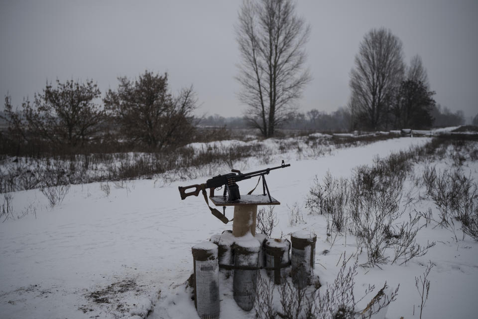 A machine gun sits on the side of a road after a Russian attack in Kyiv, Ukraine, Friday, Dec. 16, 2022. Ukrainian authorities reported explosions in at least three cities Friday, saying Russia has launched a major missile attack on energy facilities and infrastructure. Kyiv Mayor Vitali Klitschko reported explosions in at least four districts, urging residents to go to shelters. (AP Photo/Felipe Dana)