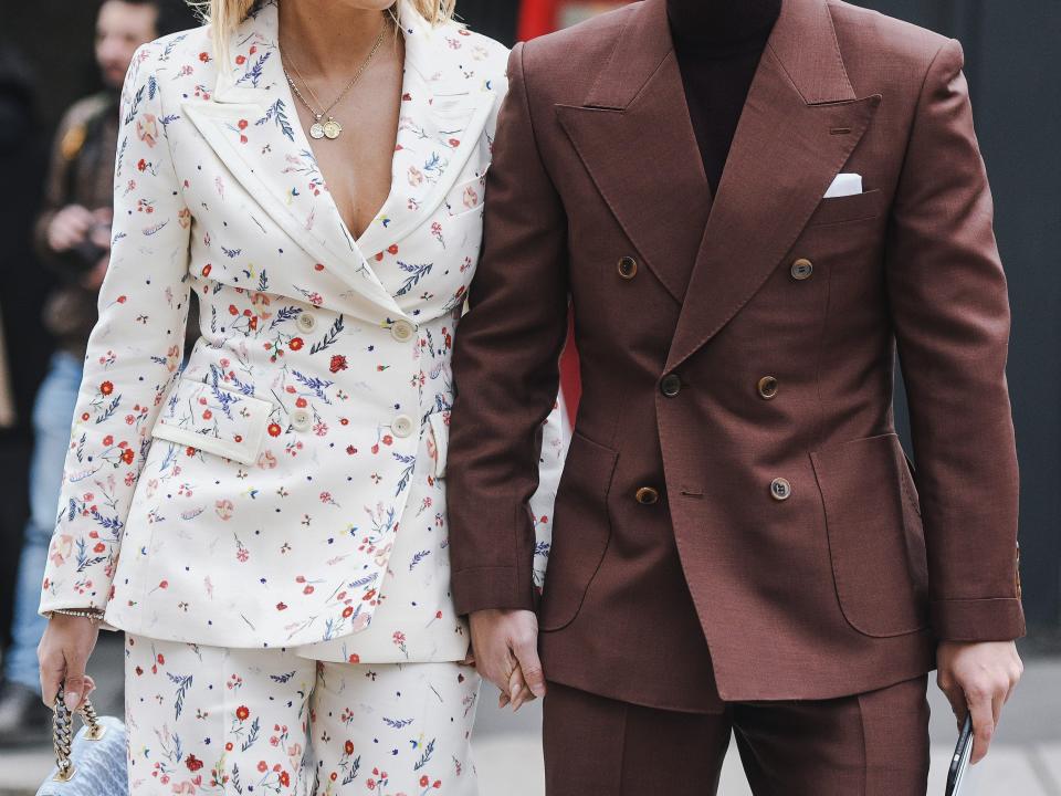 couple wearing blazers on the street