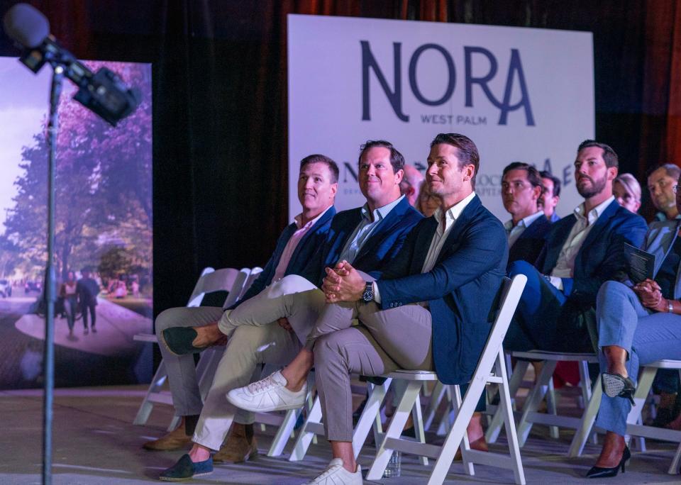 (front row) NDT Development co-founders and managing partners, Damien Barr, left, Ned Grace, center, and founder and managing principle of Place Projects Joe Furst, right, listen to Mayor Keith James at the groundbreaking ceremony for Nora, the $1 billion dining, business and residential district north of downtown West Palm Beach, Florida on May 31, 2023.