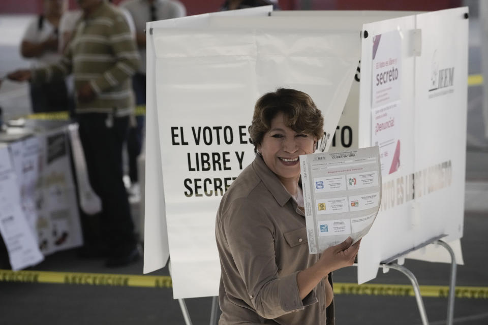 Delfina Gomez, Mexico state gubernatorial candidate for the National Regeneration Movement, or MORENA, prepares to cast her vote at a polling station in Texcoco, Mexico state, Sunday, June 4, 2023. (AP Photo/Eduardo Verdugo)