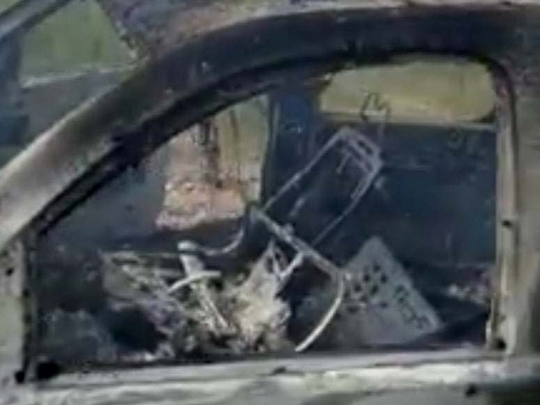 The burnt wreckage of a vehicle a Mormon family was travelling in when at least nine members were killed by gunmen during an ambush in Sonora, Mexico, on 4 November, 2019: Kenneth Miller/Lafe Langford Jr/via Reuters