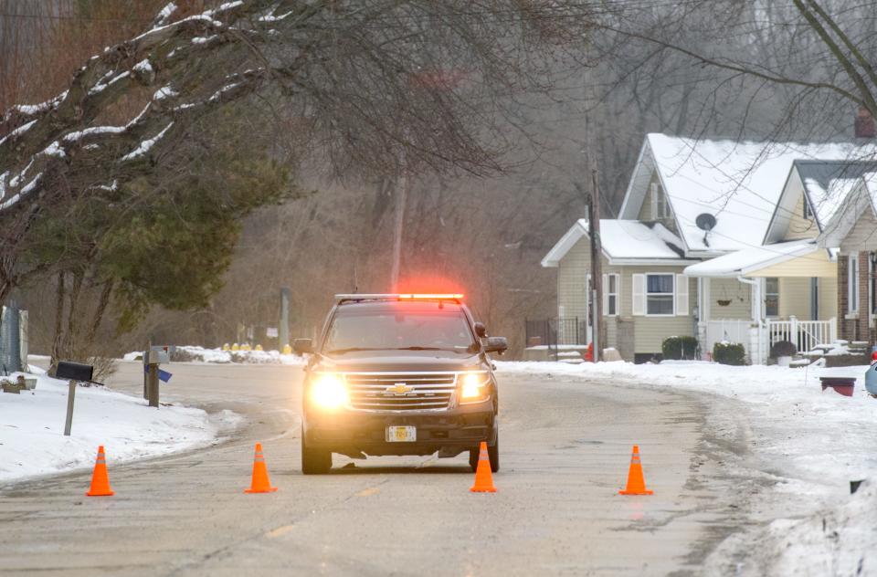 A Peoria County sheriff's deputy stands guard Monday, Jan. 22, 2024 on Southport Road in Pottstown. The road was closed between W. Pottstown Road and Farmington Road reportedly due to icy conditions and numerous vehicle accidents.
