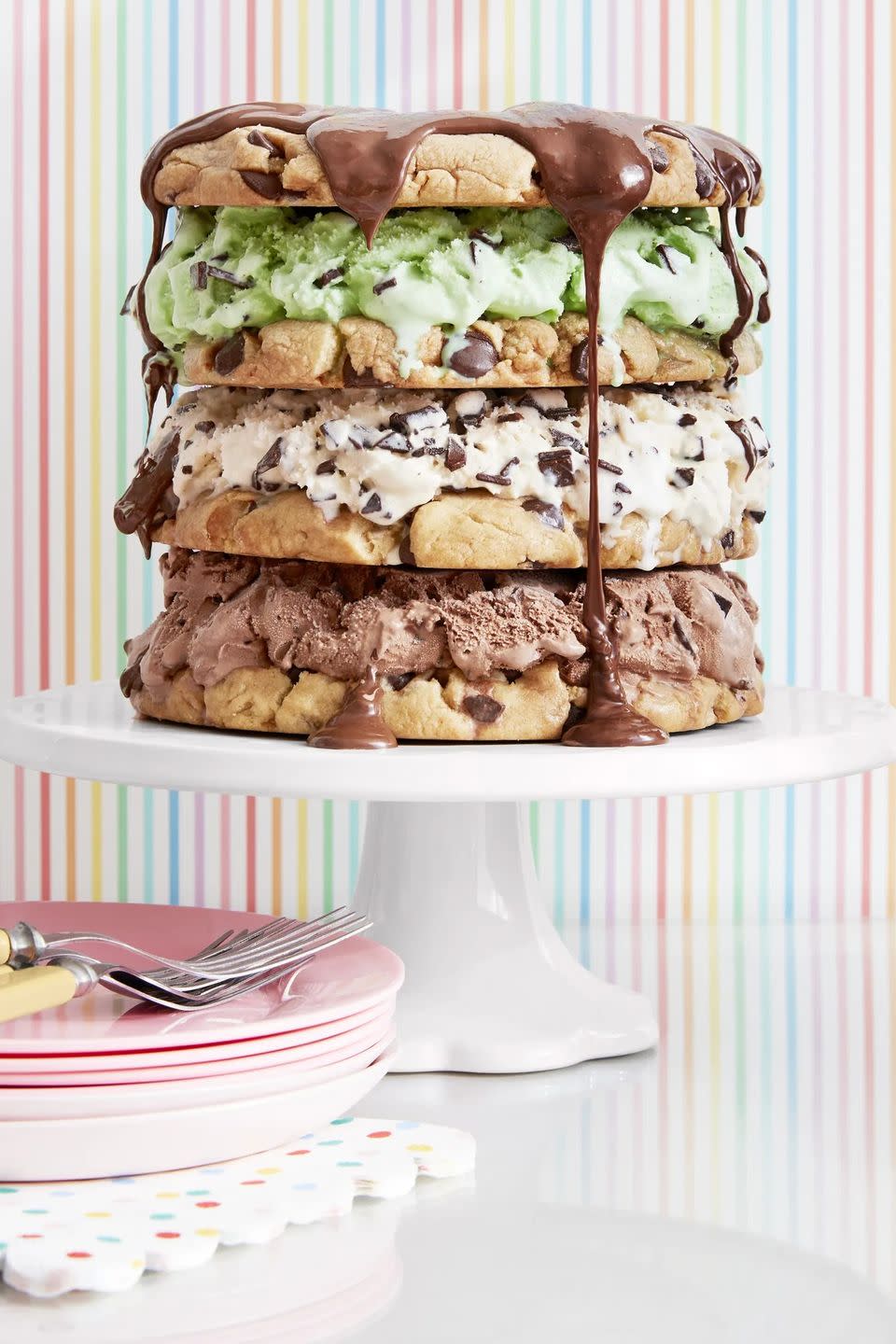 four layer chocolate chip cookie cake chocolate ice cream vanilla chocolate chip and mint chocolate chip ice cream between the layers and chocolate sauce on top