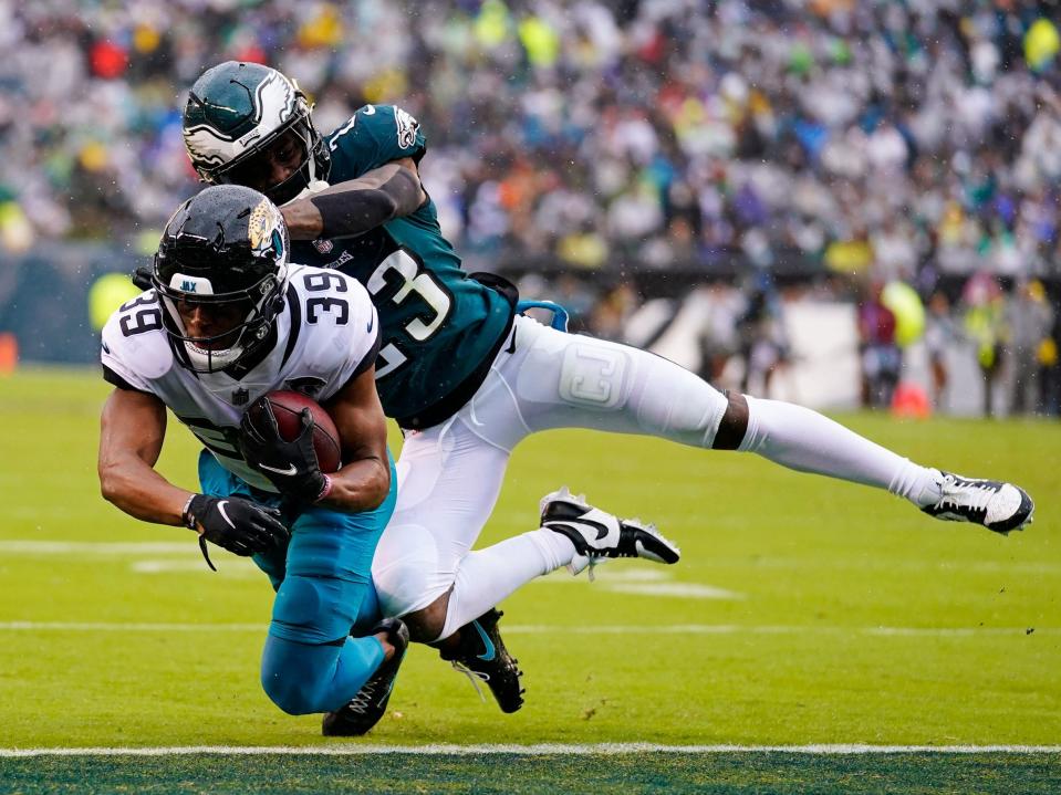 Jamal Agnew fights for a touchdown against the Philadelphia Eagles.