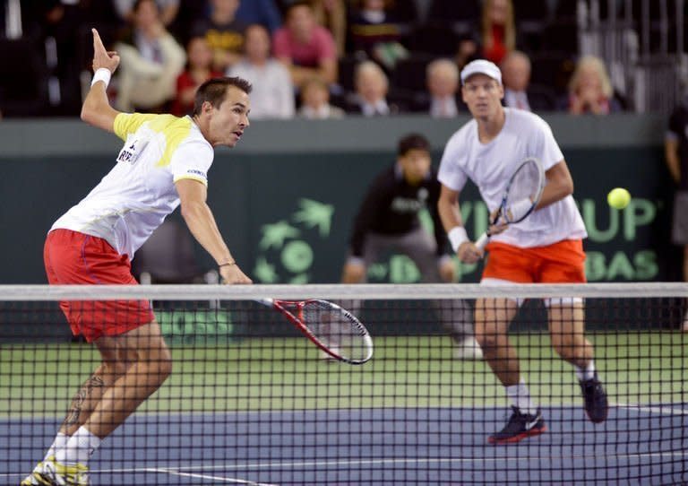 Tomas Berdych (R) and Lukas Rosol during their Davis Cup match against Stanislas Wawrinka and Marco Chiudinelli on February 2, 2013. Berdych and Rosol won 6-4, 5-7, 6-4, 6-7 (3/7), 24-22 in the longest Davis Cup clash of all time