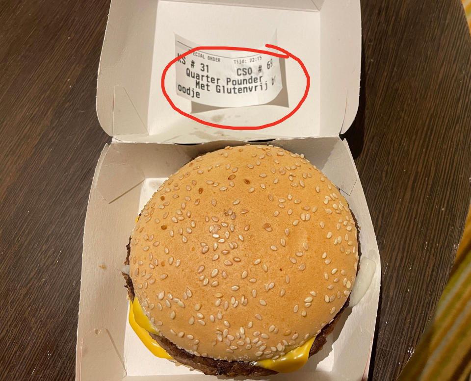 gluten free bun next to a receipt at mcdonald's