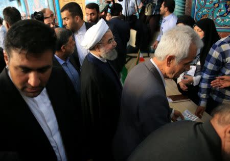 Iranian President Hassan Rouhani arrives to cast his vote during the presidential election in Tehran, Iran, May 19, 2017. TIMA via REUTERS