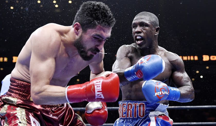 Andre Berto sends Josesito Lopez reeling with a hard right during their welterweight bout on Friday night at Citizens Business Bank Arena.