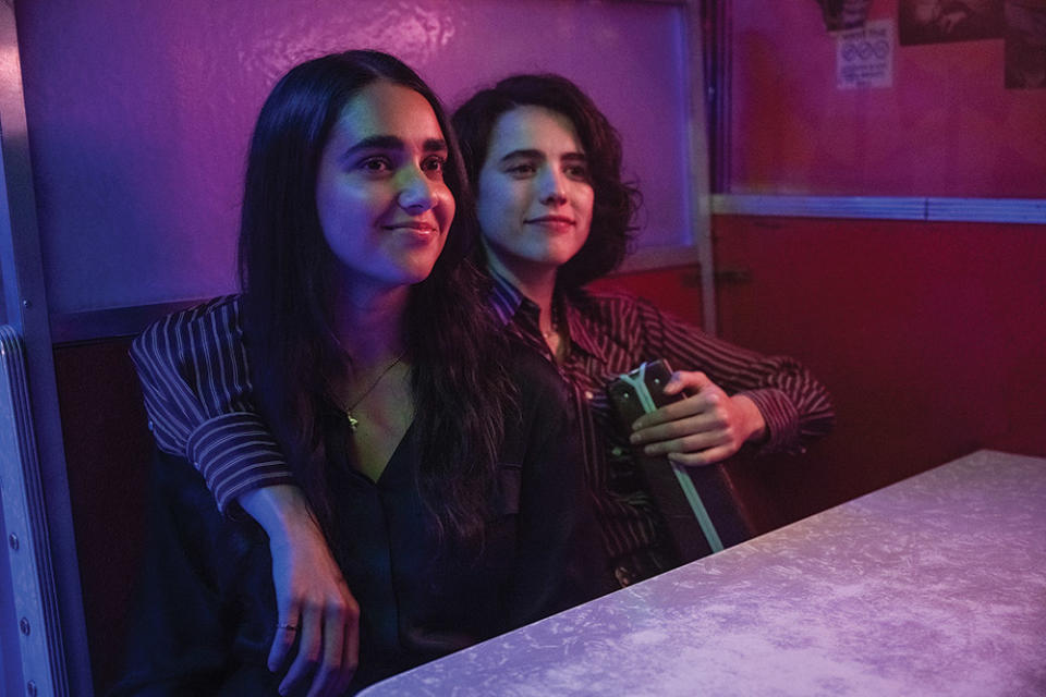Viswanathan (left) and Margaret Qualley in a scene from Drive-Away Dolls.