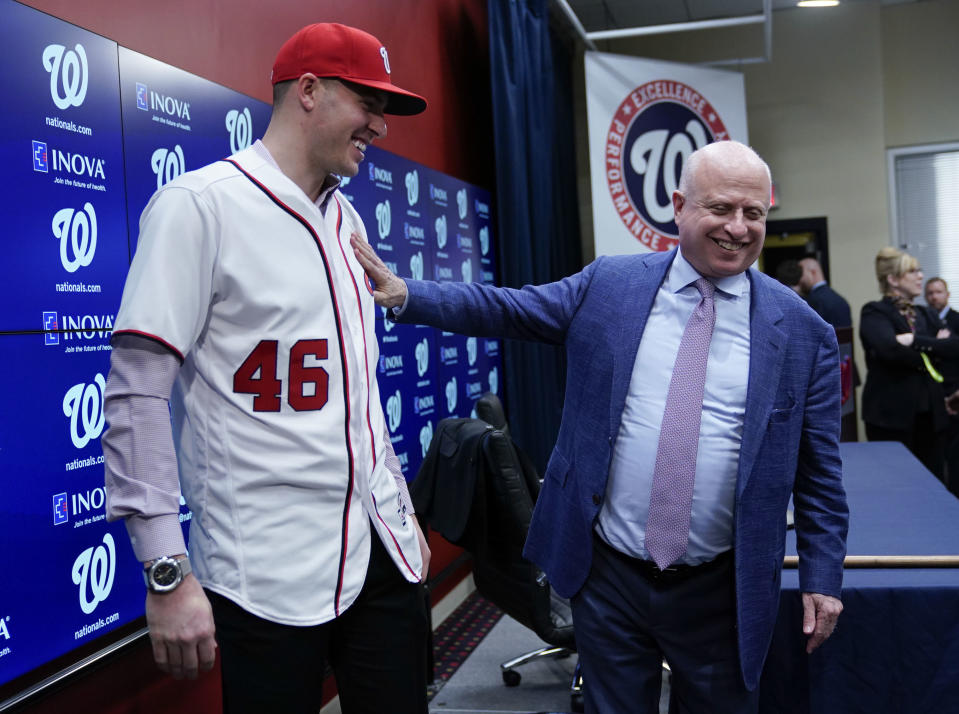 Washington Nationals owner Mark Lerner, right, greets pitcher Patrick Corbin, left, during a baseball news conference at Nationals Park in Washington, Friday, Dec. 7, 2018. Corbin agreed to terms on a six-year contract and joins the Nationals after playing for the Arizona Diamondbacks. (AP Photo/Pablo Martinez Monsivais)