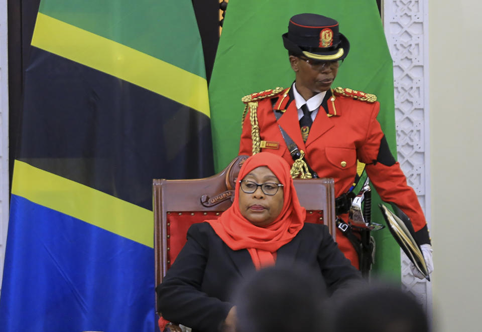 Tanzania's new president Samia Suluhu Hassan, center, is sworn in at a ceremony at State House in Dar es Salaam, Tanzania Friday, March 19, 2021. Samia Suluhu Hassan made history Friday when she was sworn in as Tanzania's first female president, following the death of her predecessor John Magufuli. (AP Photo)