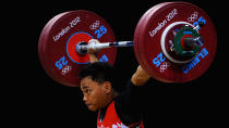 LONDON, ENGLAND - JULY 30: Irawan Eko Yuli of Indonesia competes during the Men's 62kg Weightlifting on Day 3 of the London 2012 Olympic Games at ExCeL on July 30, 2012 in London, England. (Photo by Laurence Griffiths/Getty Images)