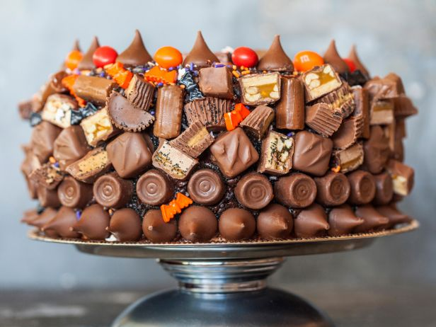 A chocolate cake covered with Halloween candy