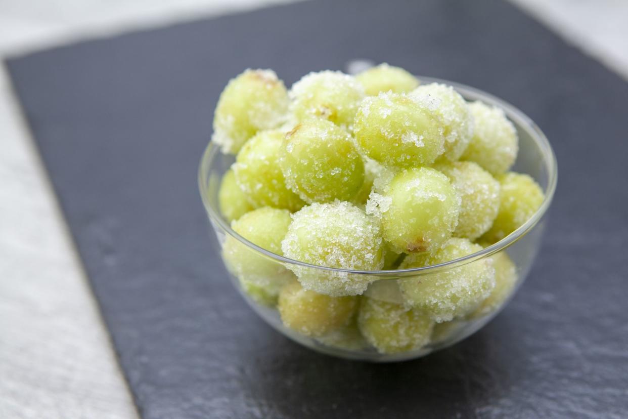 Fashionable new recipe of frozen grapes coated in lime juice and rolled in sugar