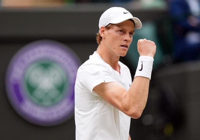 Jannik Sinner clenches his fist in celebration