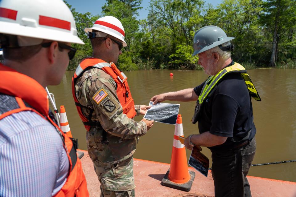 Col. Jeremy Chapman, Commander of the U.S. Army Corps of Engineers Mobile District, engages in discussions with members of the Regulatory Division, the Alabama Historical Commission, and various stakeholders aboard a survey vessel near the submerged Clotilda site in Mobile, Alabama, May 4, 2022. Collaborating closely with the AHC and other partners, the Mobile District is committed to locating and safeguarding the Clotilda, the final documented slave ship to traverse United States waters, intentionally sunk near Africatown after dropping off 110 captives to conceal this illegal operation.