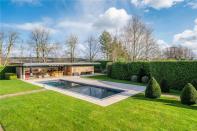 <p>There's also an outdoor heated pool and extensive pool house — the perfect party hangout spot. </p>