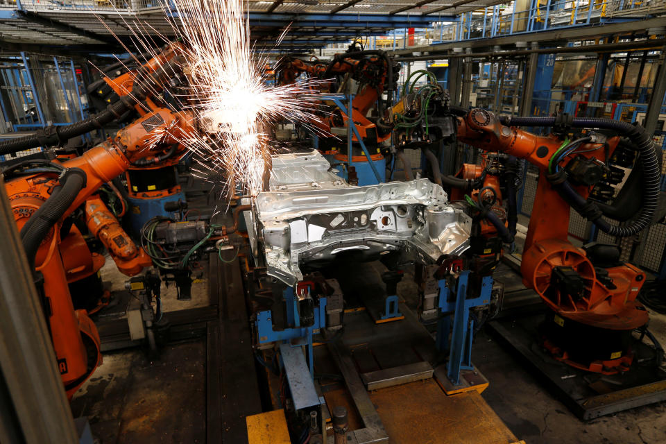 Industrial, automated robots build cars for Ford, a company that pioneered the assembly line. Source: Reuters