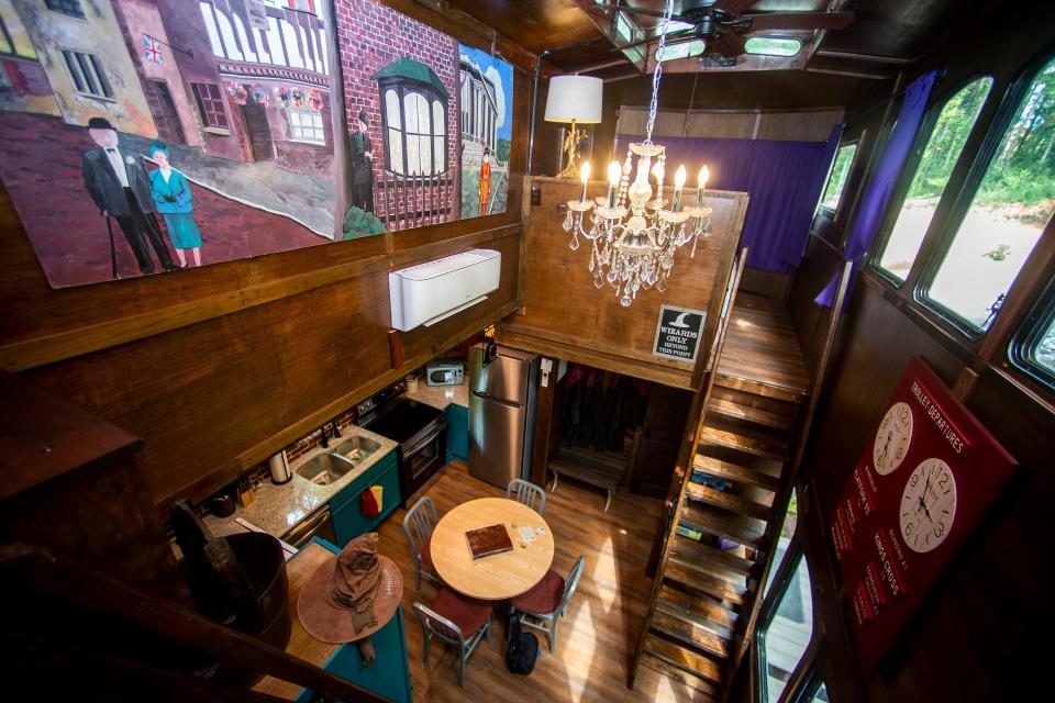 Looking down from the second floor living area inside the Harry Potter-themed Wizard's Trolley AirBnB in Kodak, Tenn., on Friday, August 19, 2022. A trolley from the 1982 World's Fair was converted a 500 sq. ft. space featuring two queen sized beds, a living area, a working kitchen and a working bathroom.