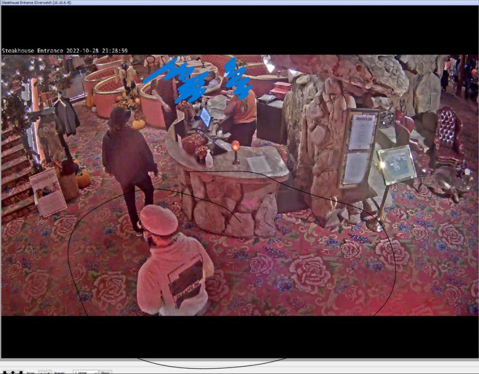 Security footage from the Madonna Inn Steakhouse shows a suspect wearing a sweatshirt with duct tape covering a logo everywhere except for the the words “Pi Kappa Phi” on Oct. 28, 2022. Courtesy of Madonna Inn