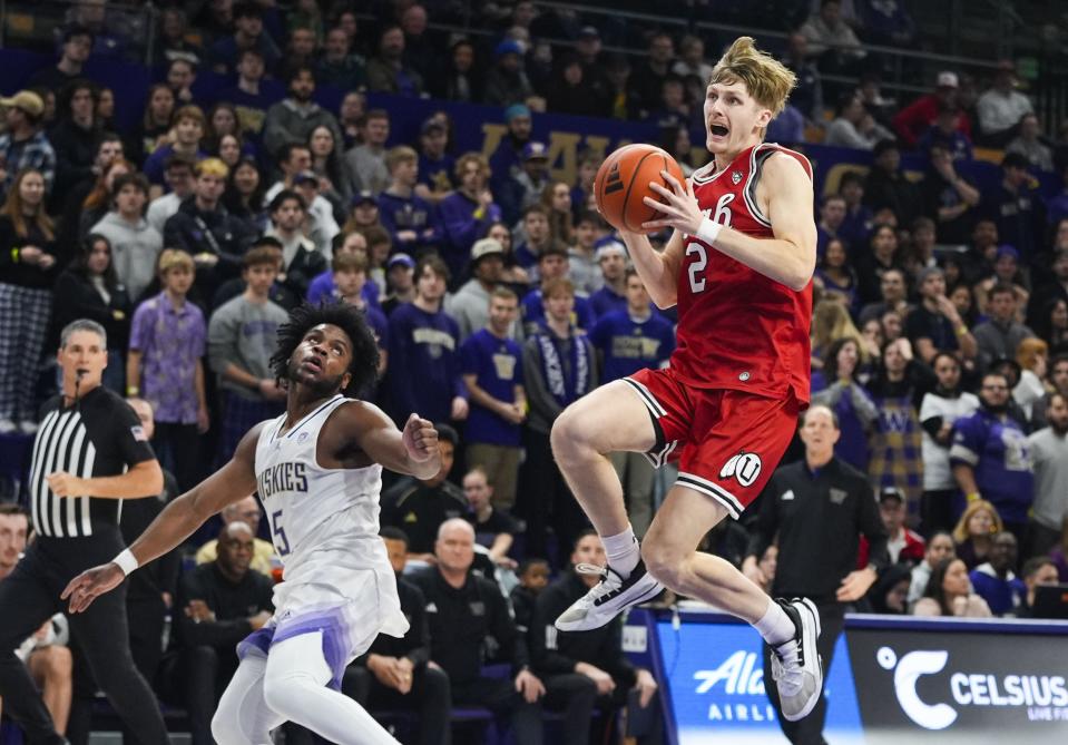 Utah guard Cole Bajema (2) prepares to shoot next to Washington guard Sahvir Wheeler (5) during the first half of an NCAA college basketball game Saturday, Jan. 27, 2024, in Seattle. | Lindsey Wasson, Associated Press