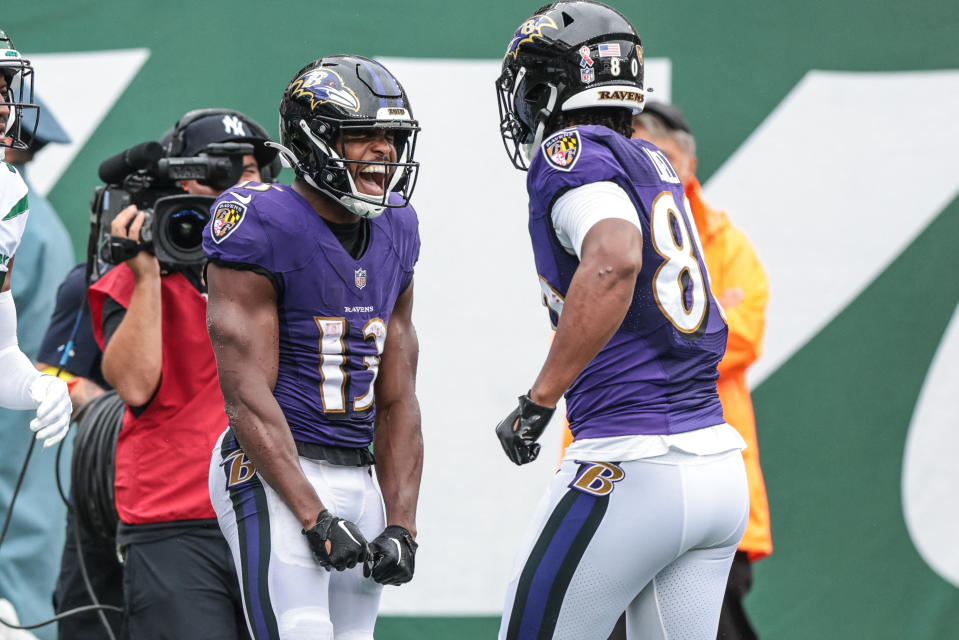 Sep 11, 2022; East Rutherford, New Jersey, USA; Baltimore Ravens wide receiver Devin Duvernay (13) celebrates his touchdown reception with tight end Isaiah Likely (80) against the New York Jets during the first half at MetLife Stadium. Mandatory Credit: Vincent Carchietta-USA TODAY Sports