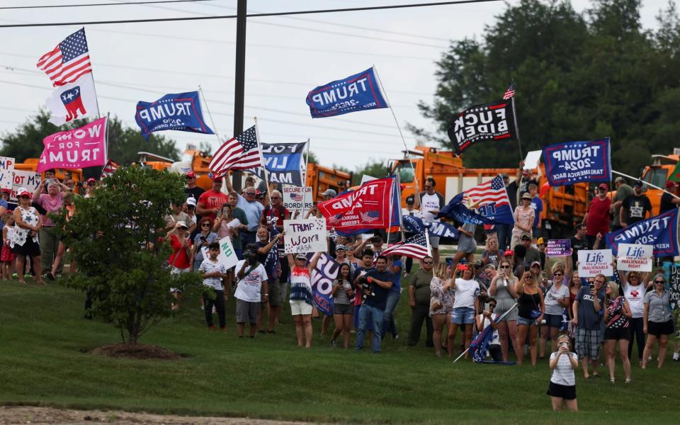 Supporters of Former President Donald Trump protest outside the venue during a visit of U.S. President Joe Biden to the northwest Chicago suburb Crystal Lake, Illinois - Reuters