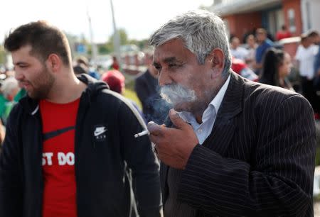 Roma people gather on the outskirts of the town to commemorate the killings of Roma people by right-wing militants in 2009, in Torokszentmiklos, Hungary, May 21, 2019. REUTERS/Bernadett Szabo